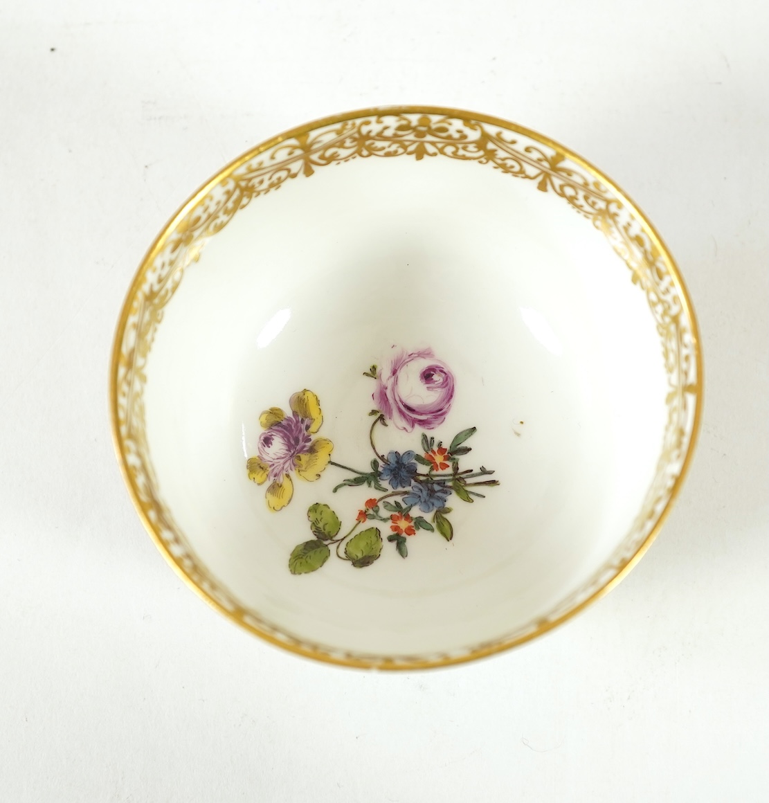 A Meissen cup and saucer, similar tea bowl and two saucers, c.1735-45